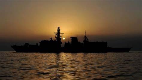 China 'building runway in disputed South China Sea island'-warship-sunset-jpg